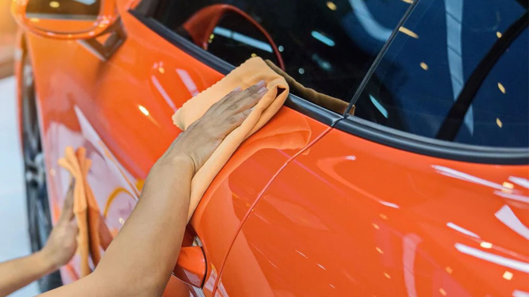 IX Exotics technician installing ceramic coating on a